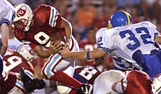 Giles' Cody Journell (9) gets past Blacksburg's Adam Siegel (32) for a 5-yard gain.